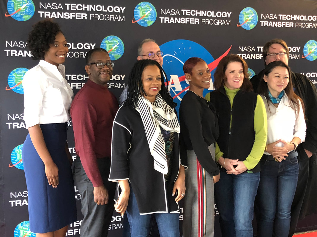 TIME Challenge participants posing together before the NASA Technology Transfer Program backdrop